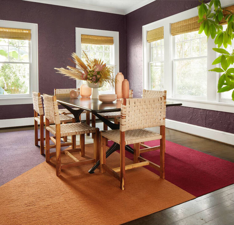 FLOR Made You Look dining room rug shown in Pearl, Berry, Copper, and Lavender